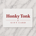 Honky Tonk gift card on a marble surface